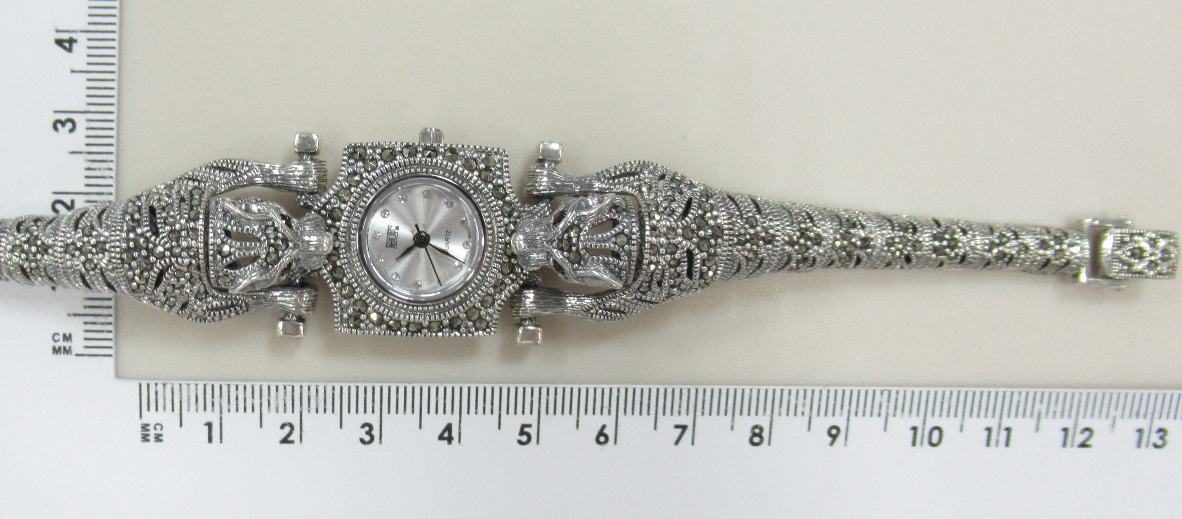 Серебряные часы с гранатами и марказитами "Пантеры"